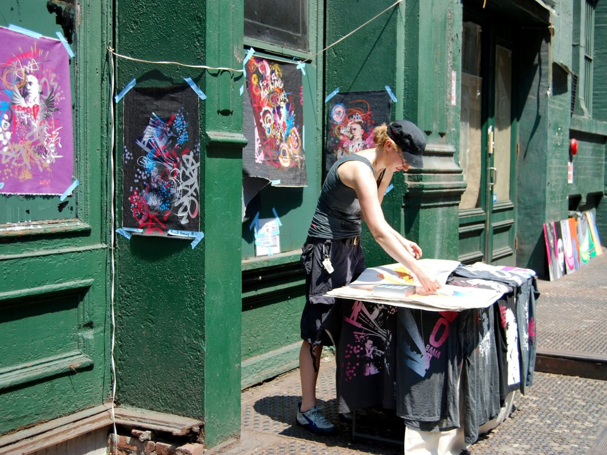 Woman selling art on the street