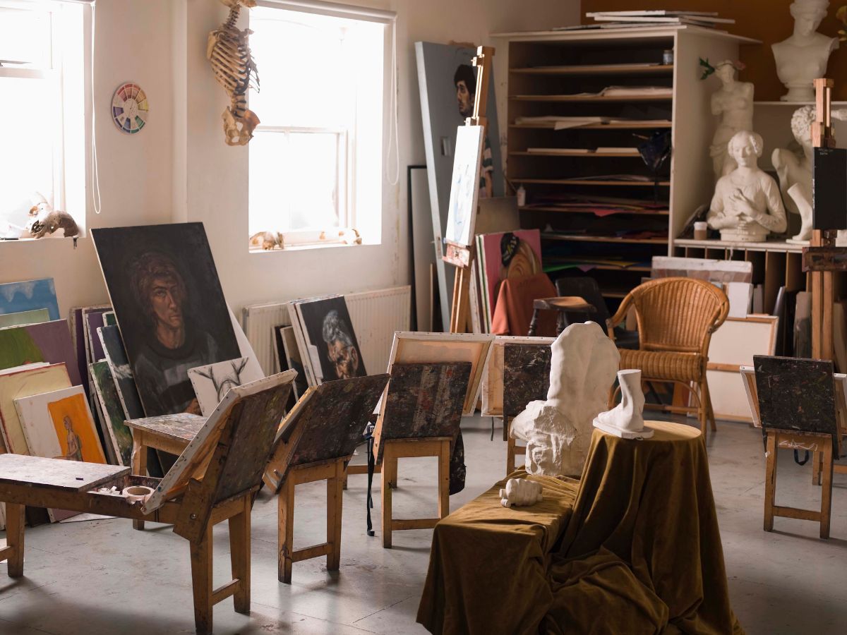 art studio with paintings and sculpture