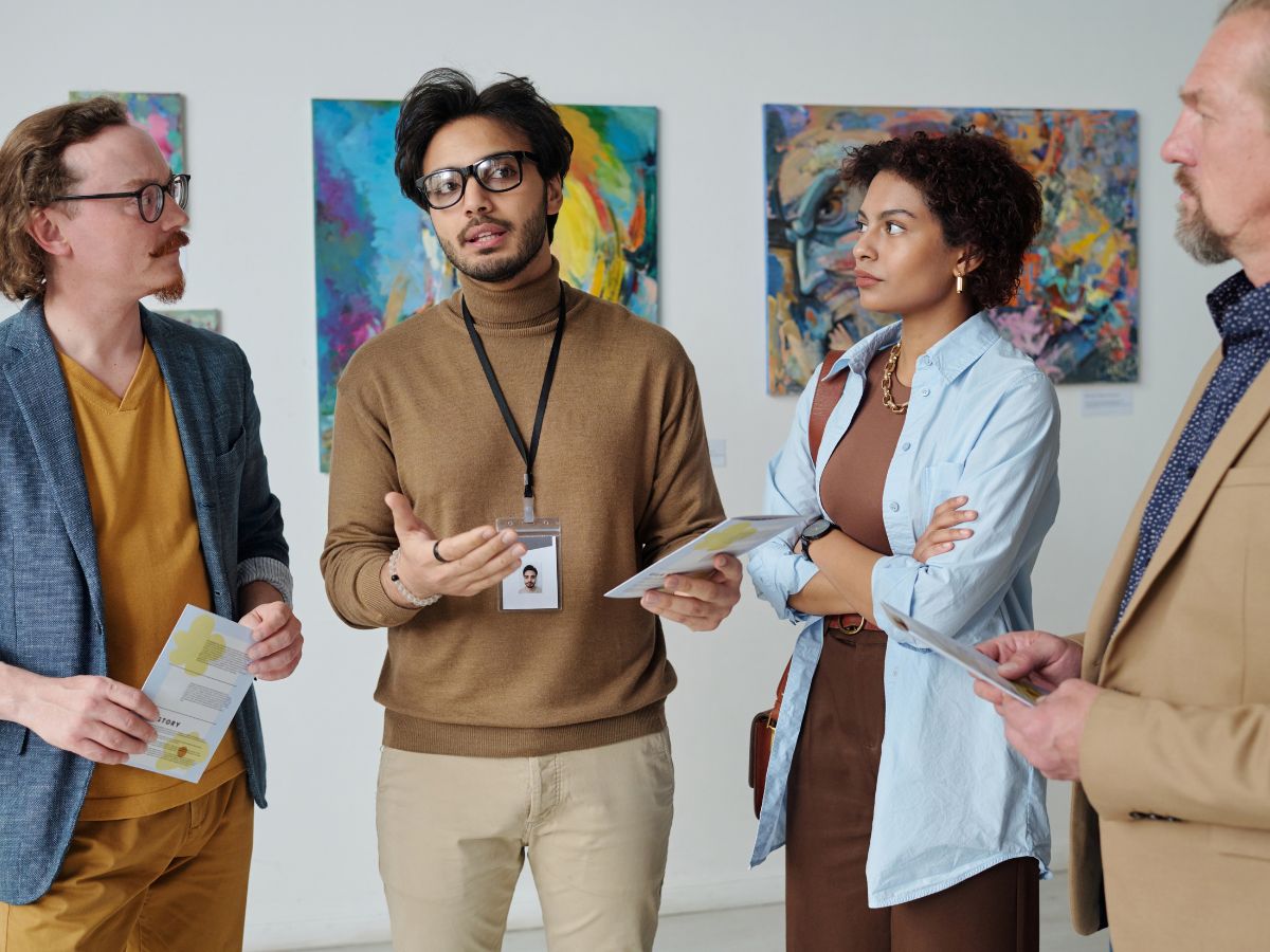 people discussing in art-gallery