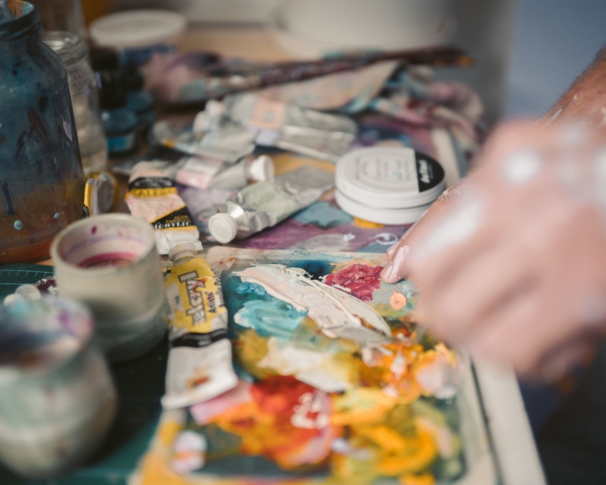 person mixing oil paints