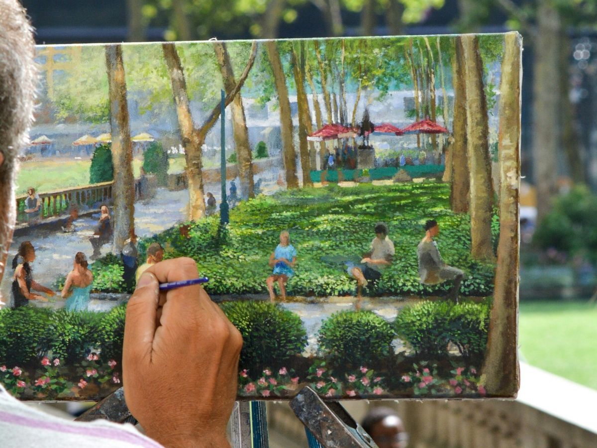 Plein-air painting of people sitting on bench during daytime