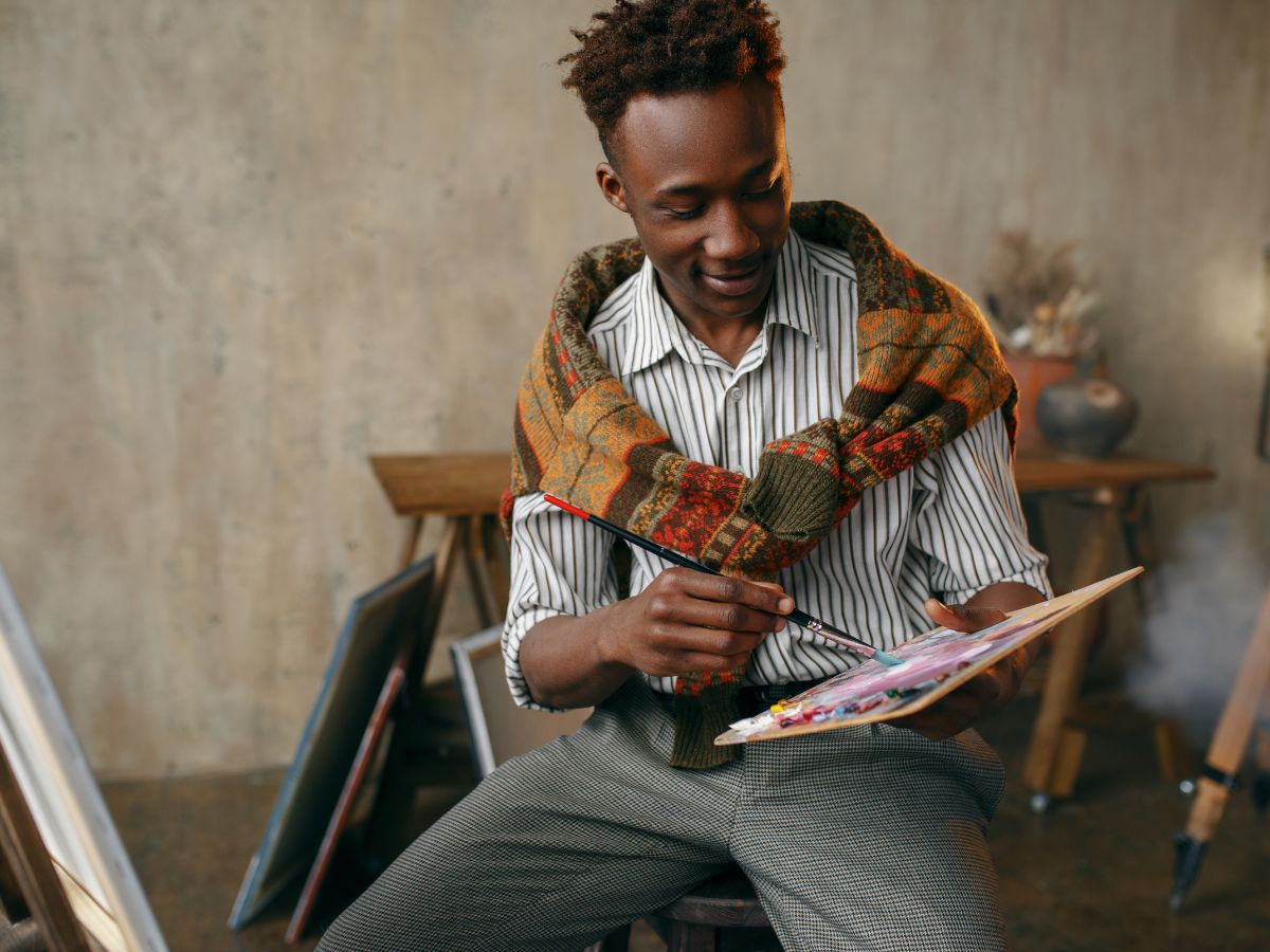 painter holding a paint palette