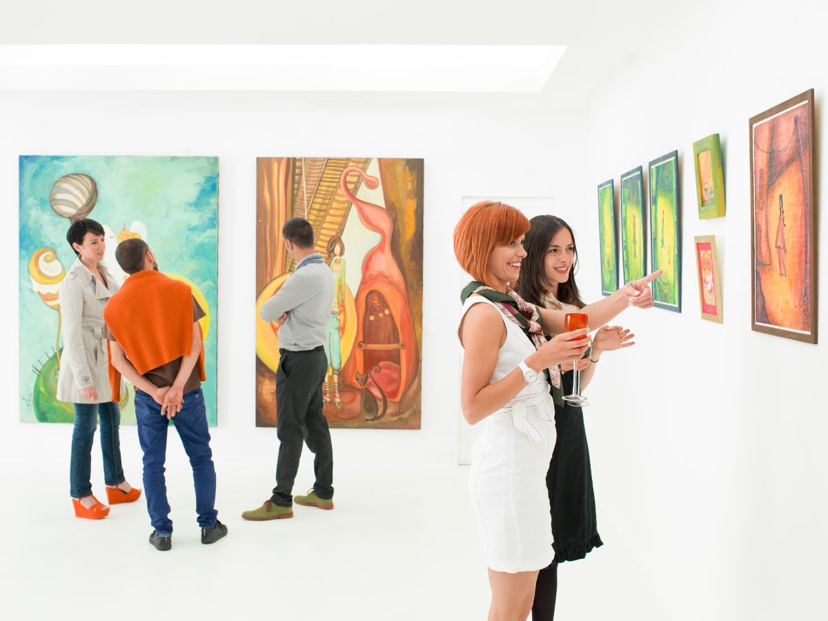 guests talking at an art exhibit