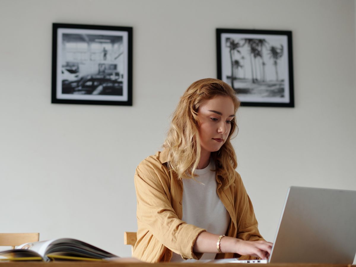 art gallery owner working on a laptop