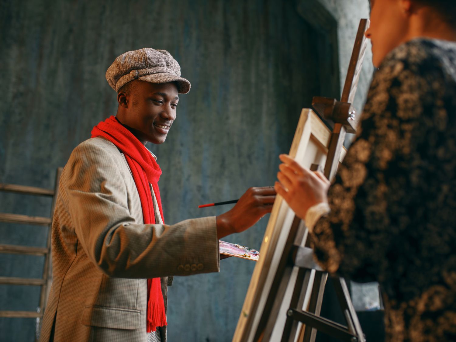 artist painting on canvas