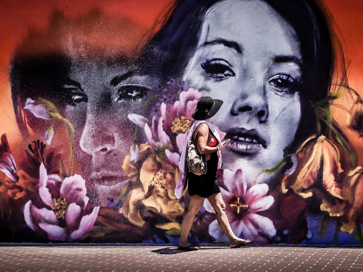 woman looking at a mural