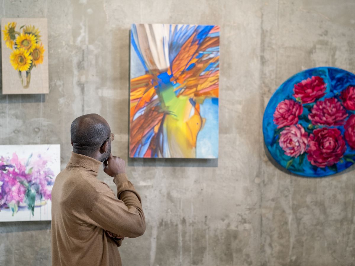 a man visiting an art gallery